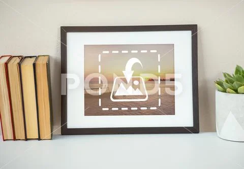 PSD template of books with picture frame and pot plant on table Modello PSD