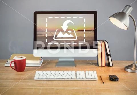 PSD template of books, table lamp and desktop pc with coffee cup on table in PSD Template