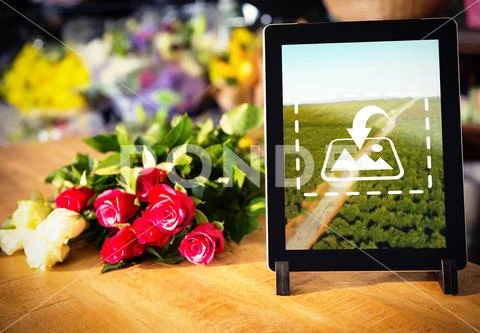 PSD template of bunch of roses and digital tablet on the wooden table at a Modello PSD