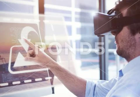 PSD template of businessman using virtual reality headset at desk in office PSD Template