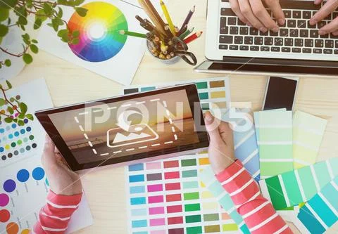 PSD template of Close-up of graphic designer working at his desk in office. PSD Template
