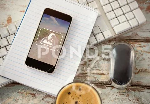 PSD template of cup of coffee with keyboard, mobile phone and mouse on wooden PSD Template