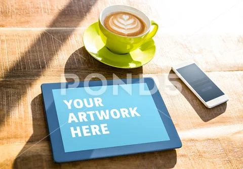 PSD template digital tablet and mobile phone with coffee cup on wooden table PSD Template