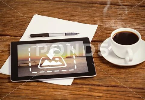 PSD template of digital tablet with black coffee cup, paper and pen on wooden PSD Template