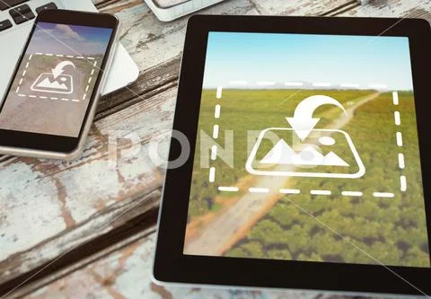 PSD template of digital tablet with mobile phone and laptop on wooden table PSD Template