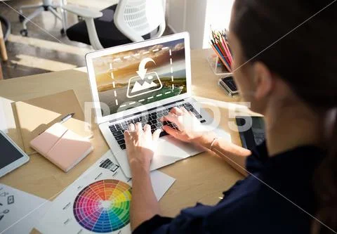 PSD template of female graphic designer working on laptop at desk in office PSD Template