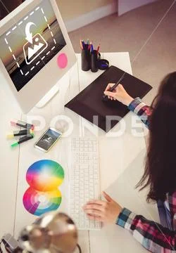PSD template of female graphic designer working at desk in office PSD Template