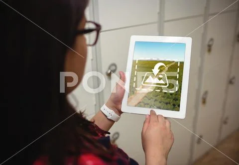 PSD template of female student using digital tablet in locker room at college PSD Template