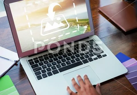 PSD template of hand using laptop on wooden table in office PSD Template