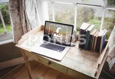 PSD template of laptop and books on wooden desk at home PSD Template