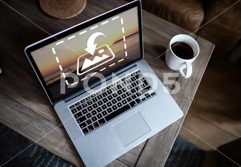 PSD template of laptop and coffee cup on wooden table at home PSD Template
