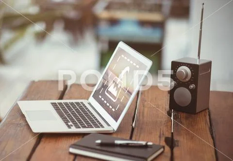 PSD template of laptop and speaker with diary on table at home PSD Template