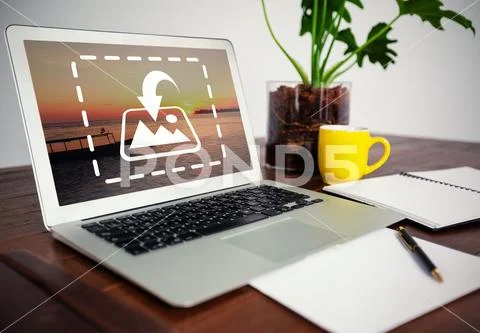 PSD template of laptop, coffee mug and notepad at desk in office PSD Template