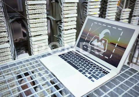 PSD template of laptop kept on rack in server room PSD Template