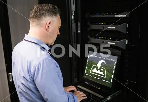 PSD template of male technician working on laptop in office PSD Template