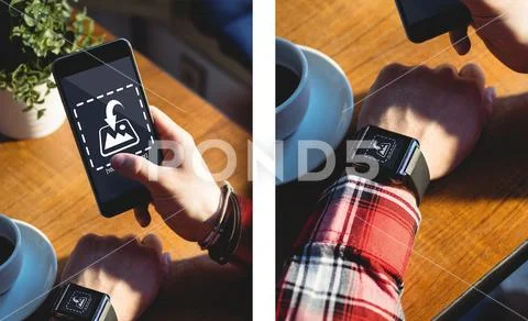 PSD template of man hands using mobile phone and smart watch at wooden table in PSD Template
