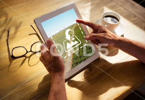 PSD template of man hands using a digital tablet in a cafe PSD Template