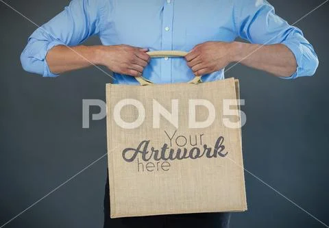 PSD template of man holding shopping bag against grey background PSD Template
