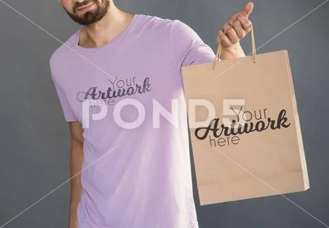 PSD template of man holding shopping bag against grey background PSD Template