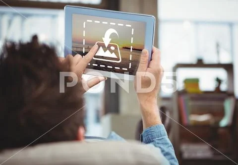 PSD template of man relaxing and using digital tablet at home PSD Template