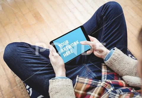 PSD template of man sitting on floor and using digital tablet at home PSD Template