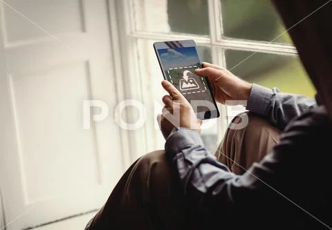 PSD template of man using digital tablet near window at home PSD Template