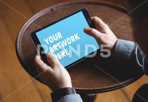 PSD template of man using digital tablet at home PSD Template