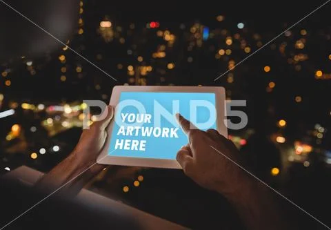 PSD template of man using digital tablet on balcony at night PSD Template