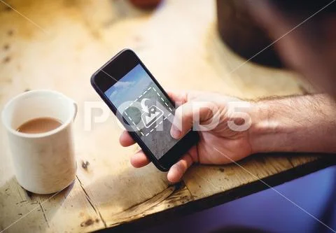PSD template of man using mobile phone at wooden table in cafe PSD Template