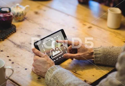 PSD template of man using tablet at wooden table in house Template PSD