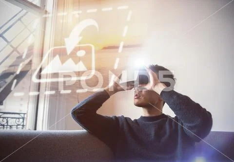 PSD template of man using virtual reality headset in living room at home PSD Template