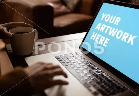 PSD template of man working on laptop while having coffee at table in home PSD Template