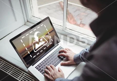 PSD template of man working on laptop at window sill in home PSDテンプレート