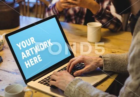 PSD template of man working on laptop at table in cafe PSD Template