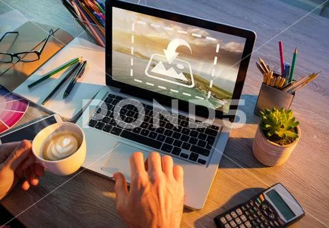 PSD template of office executive drinking coffee while working on laptop at desk PSD Template