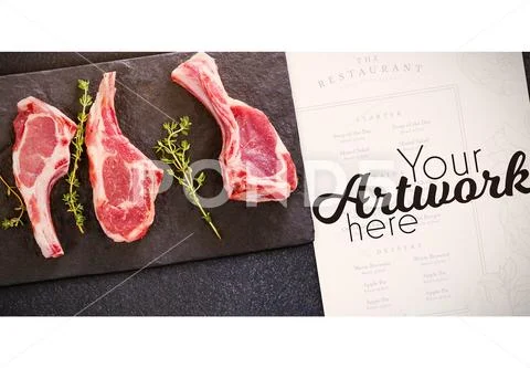 PSD template of rib chop and herb on black slate plate against black background Modello PSD