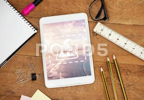 PSD template of stationery, spectacle, diary and digital tablet on wooden table PSD Template