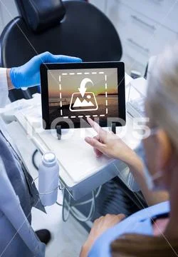 PSD template of surgeons discussing over digital tablet in hospital Template PSD
