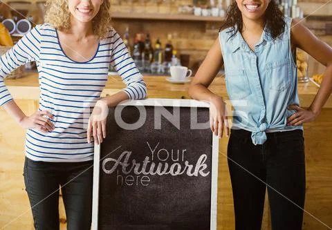 PSD template of two female friends standing with signboard at counter in café PSDテンプレート