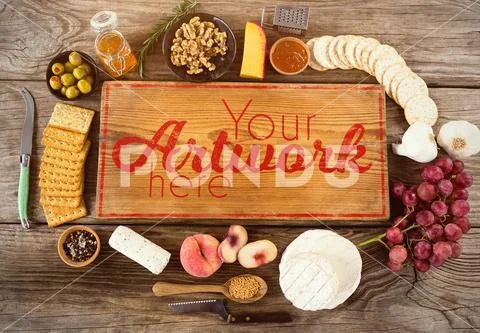 PSD template of various food items and chopping board on wooden background PSD Template
