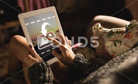 PSD template of woman using digital tablet on sofa at home PSD Template