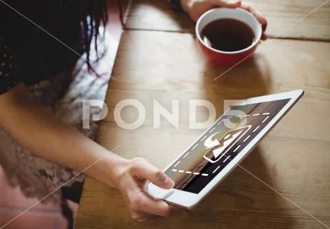 PSD template of woman using digital tablet while having coffee at table in home PSD Template
