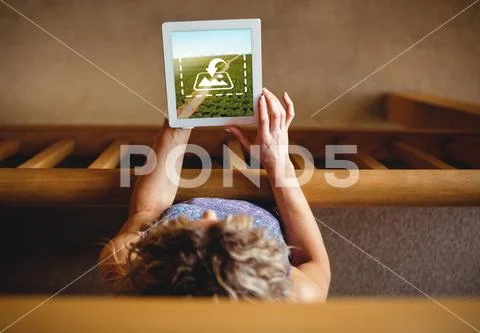PSD template of woman using digital tablet near wooden railing PSD Template