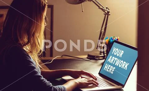 PSD template of woman using laptop at table in home PSD Template