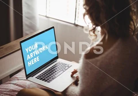 PSD template of woman using laptop on bed in bedroom at home PSD Template