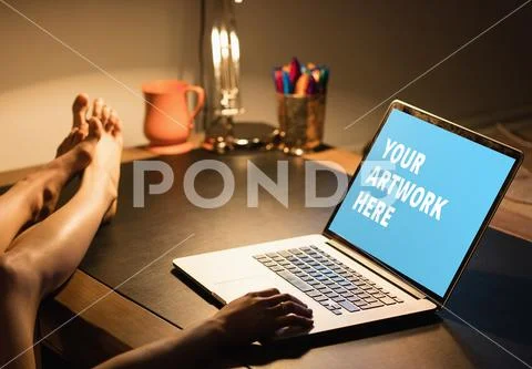 PSD template of woman working on laptop at dining table in home PSD Template