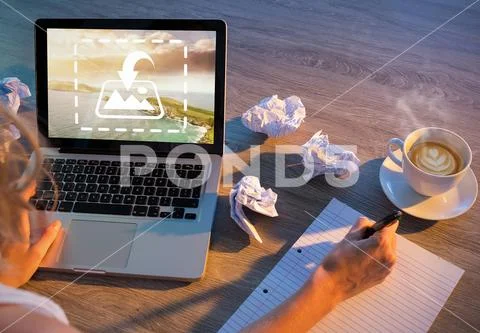PSD template of woman writing on notepad while working on laptop at desk in PSD Template