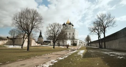 Pskov. Kremlin on background of blue sky and gray clouds Stock Photos