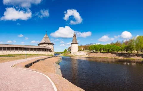 Pskov kremlin tower with blue cloudy sky Stock Photos