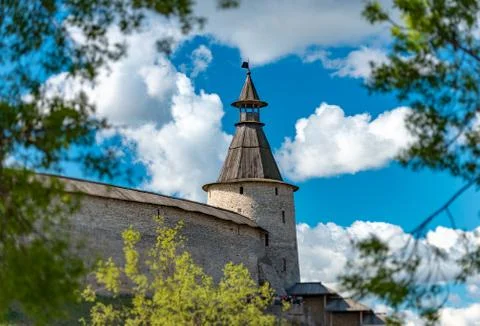 Pskov kremlin tower with blue cloudy sky Stock Photos